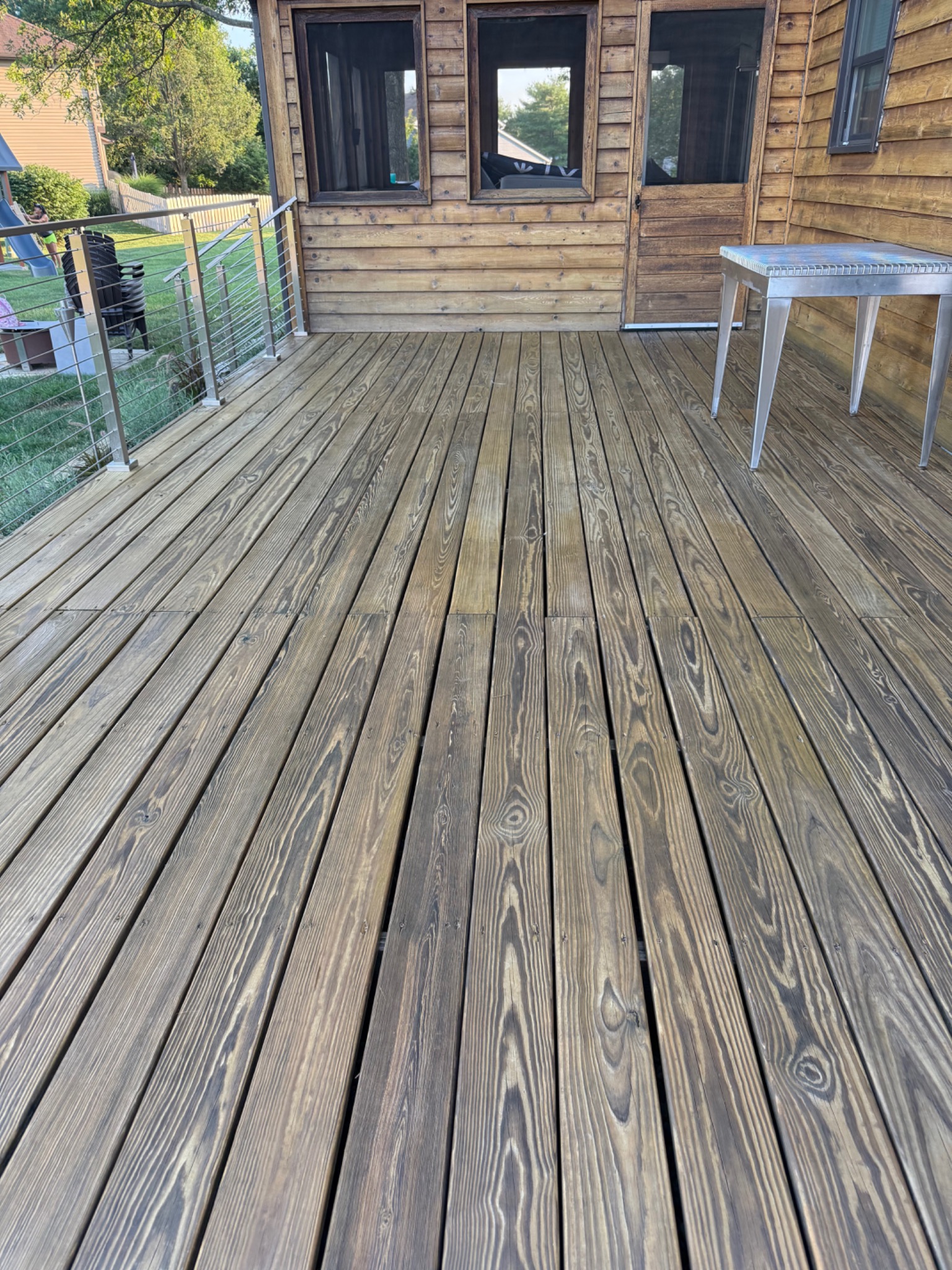 Stained deck railing with clean edges and consistent finish